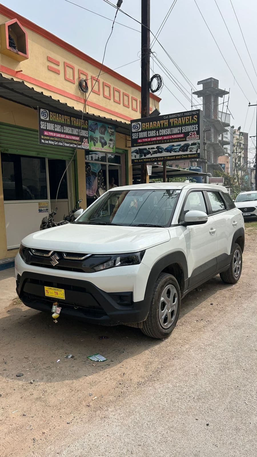 A photo of a Maruti Brezza 2026 VXI - White SUV.
